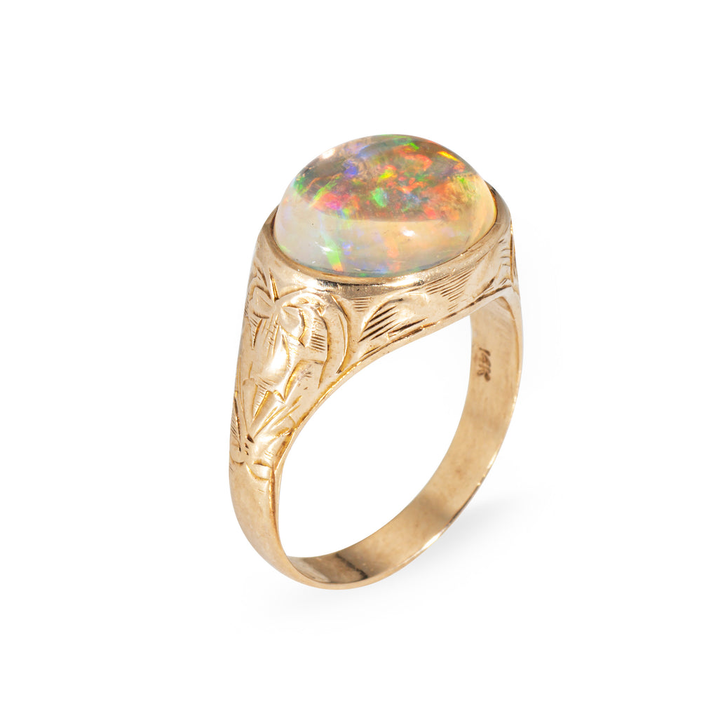 Victorian Gold ring with an opal stone on a white background
