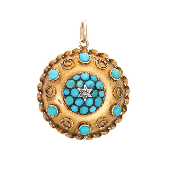 Antique Victorian locket with turquoise stones and a diamond star design on a white background