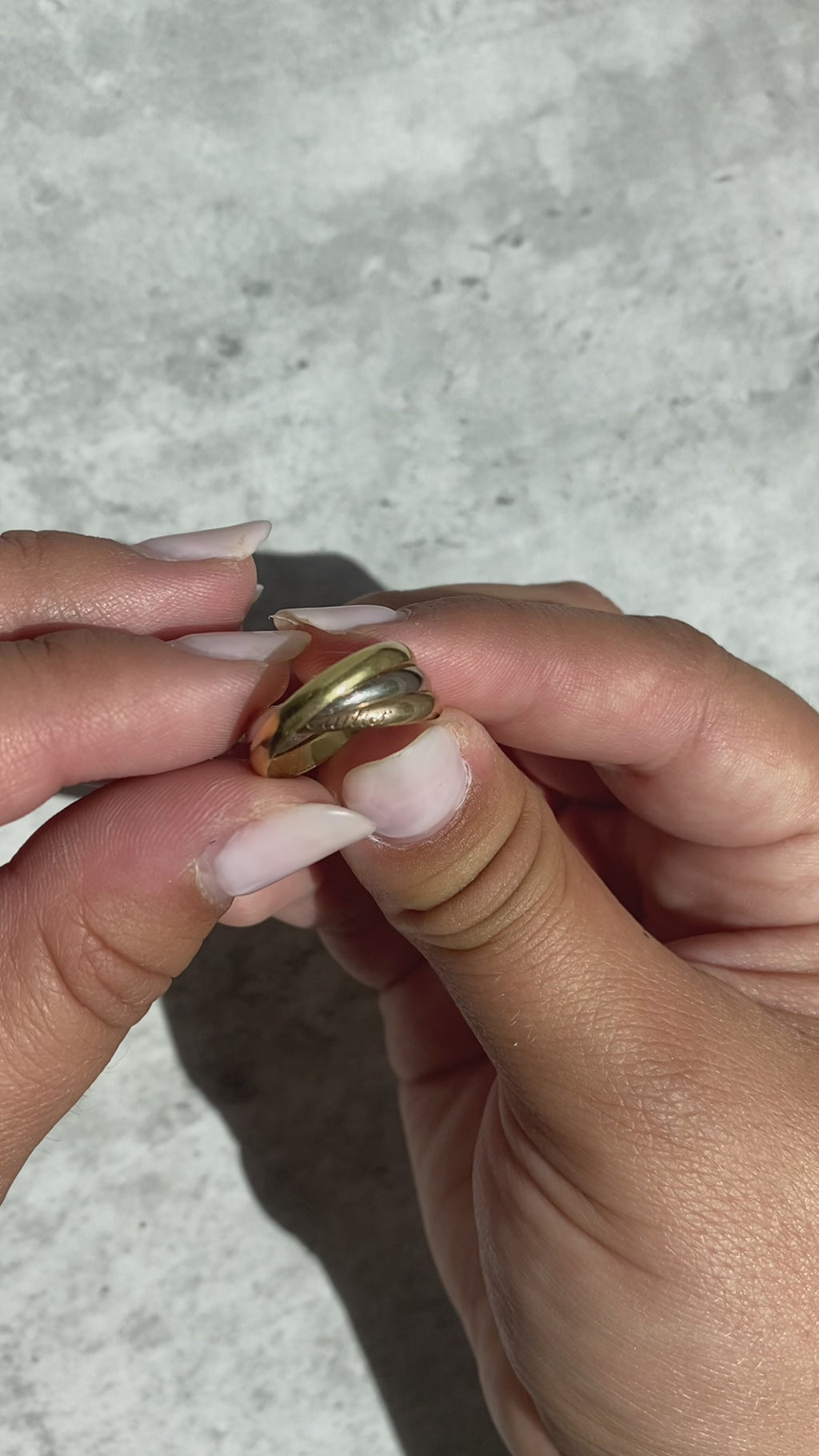 Cartier trinity ring on hand top